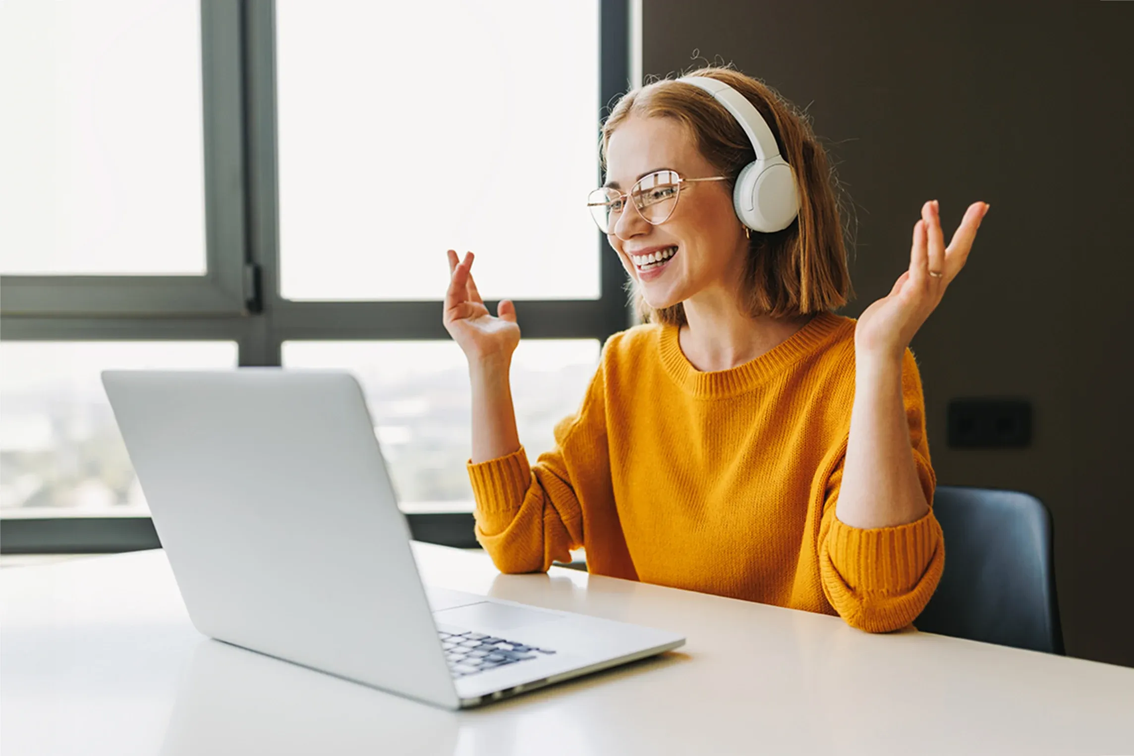 Woman talks on video call at home.